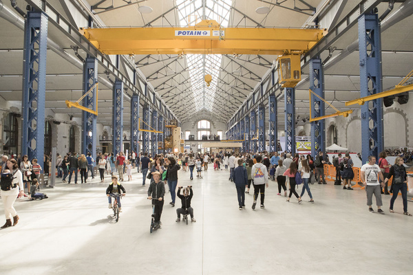 Les Ateliers des Capucins after rehabilitation, showing preserved industrial structures and machinery now occupied with business, leisure and cultural facilities, combining heritage conservation with contemporary uses.