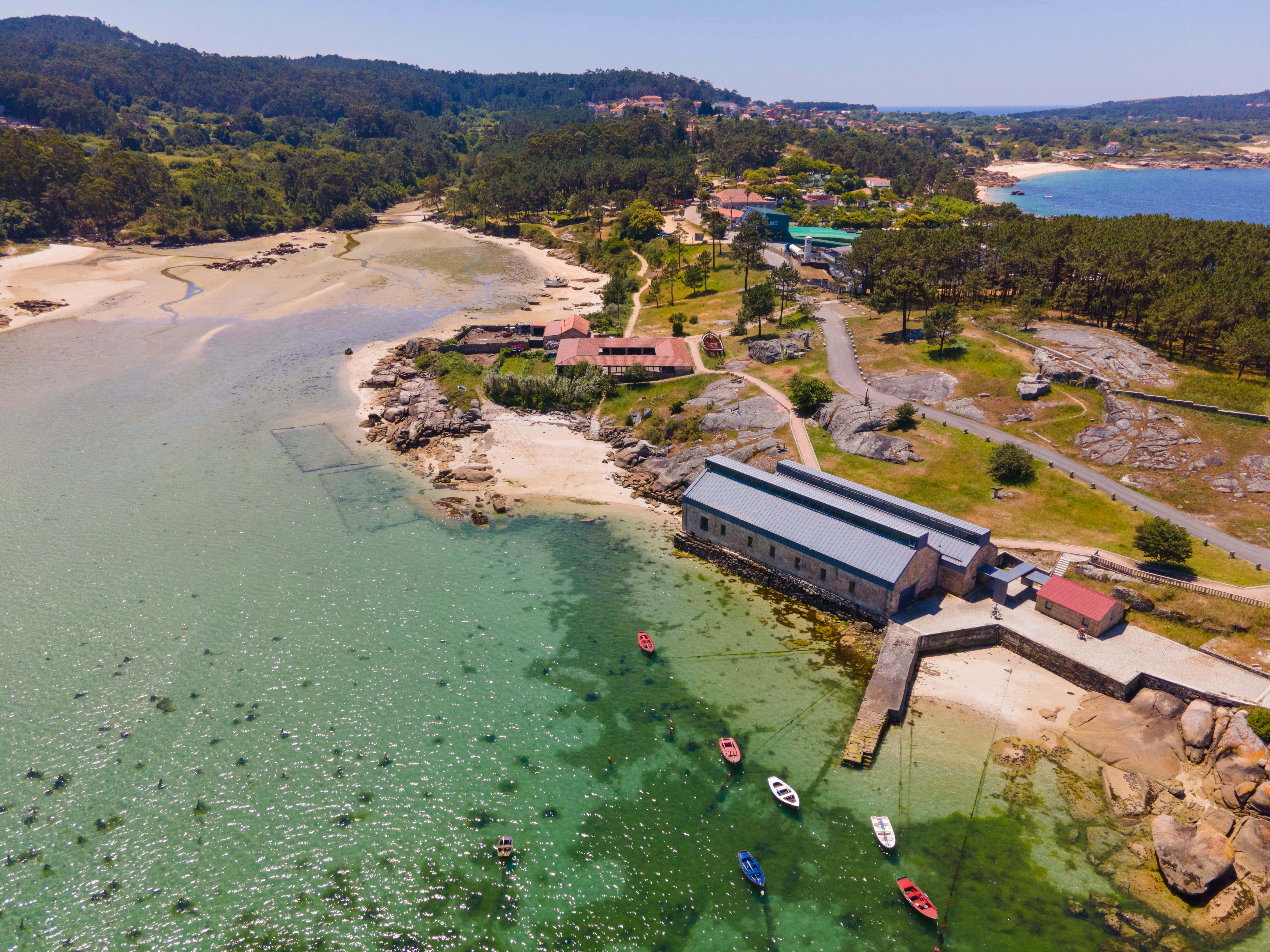 Aerial view of the restored Salgadeiras de Moreiras Museum, integrating the former salting and canning factories within the coastal landscape and preserving the historical connection between architecture, fishing, and marine resources.