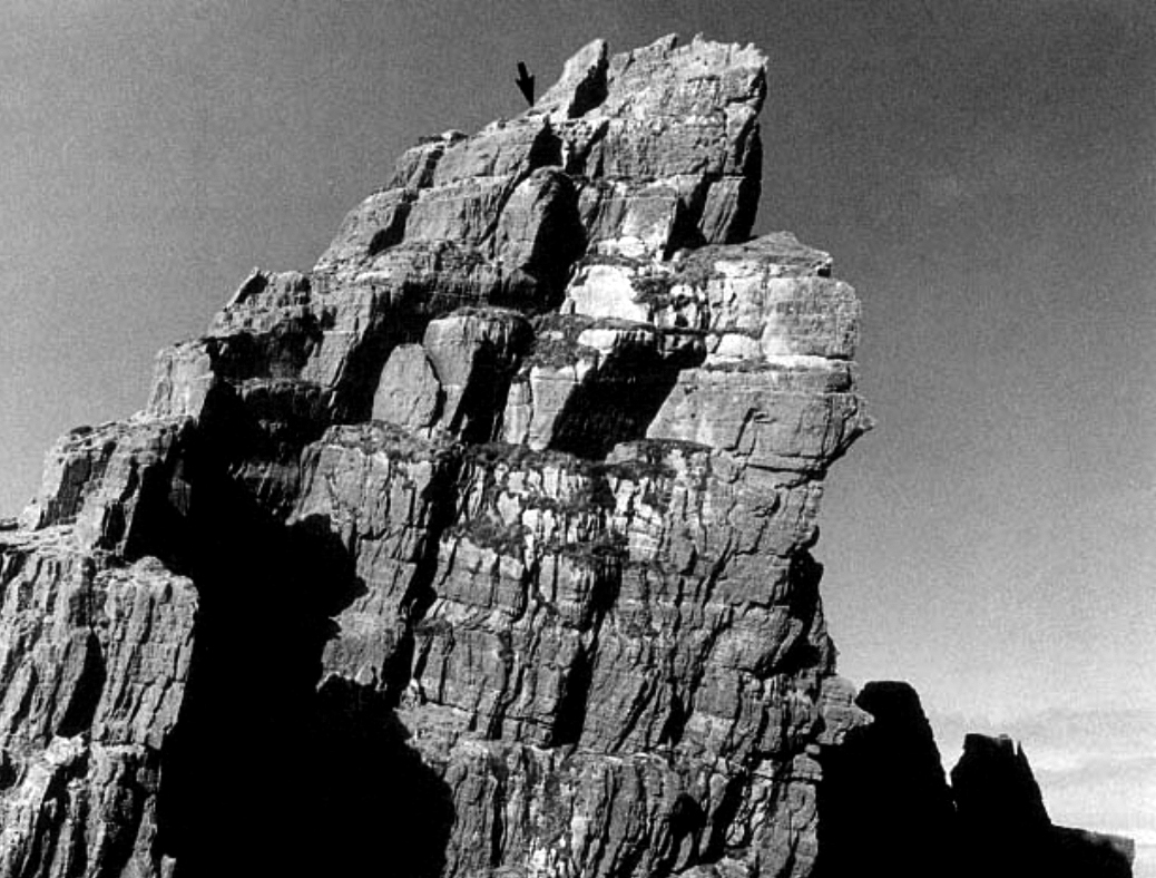 Rock-cut steps and ledges enabling circulation across near-vertical terrain, illustrating precise spatial adaptation to topography.